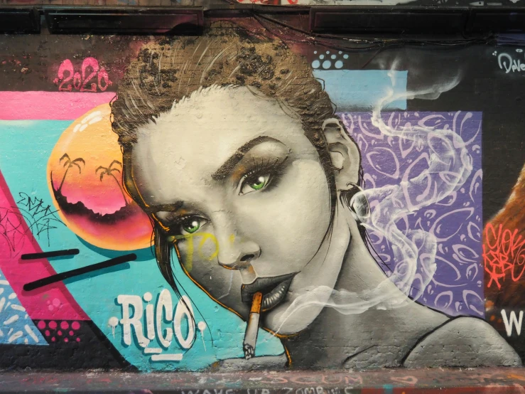 graffiti painted on the side of a building shows a woman with cigarette in her mouth