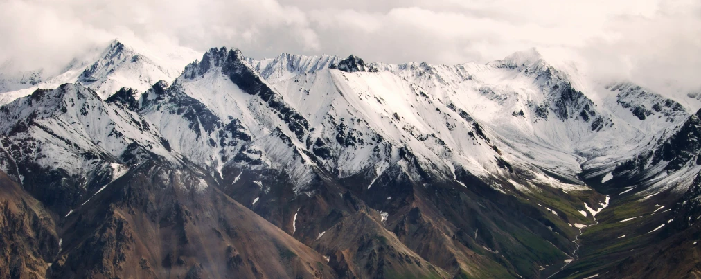 the snow capped mountains on the way to machak