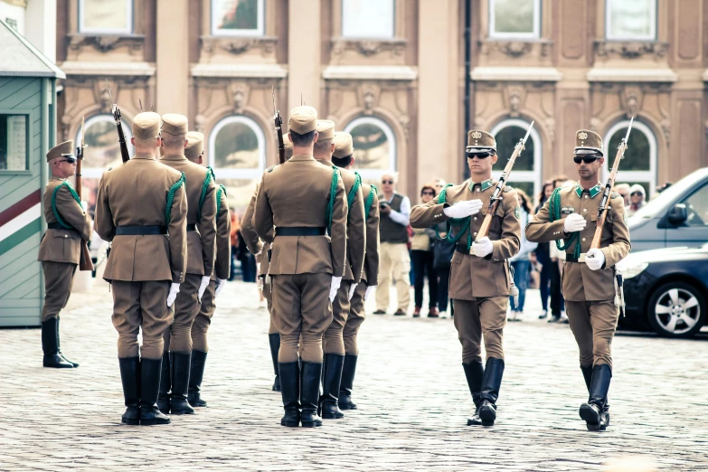 military men are marching on the stone street