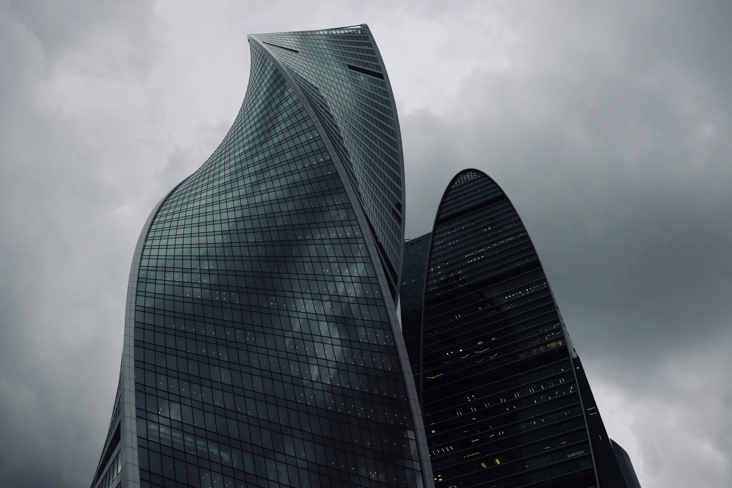 tall modern building in front of a cloudy sky