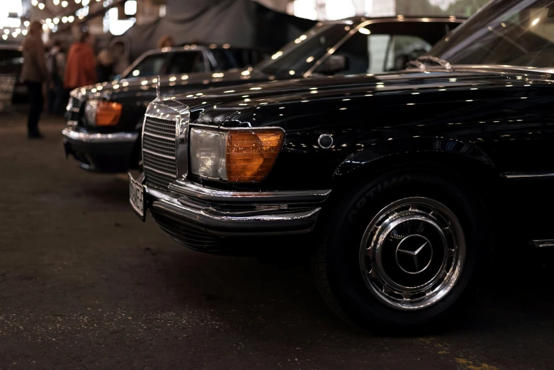 a group of cars that are parked in the dirt