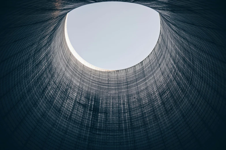 the sky is seen above a circular hole