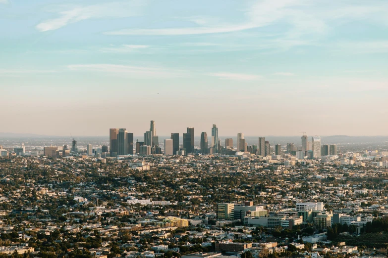 a city with many tall buildings, and many trees