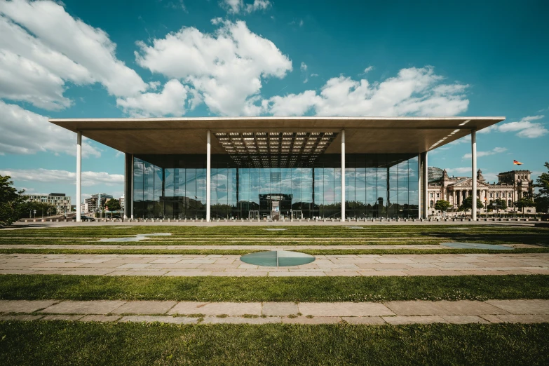 an open area in front of a building with many columns