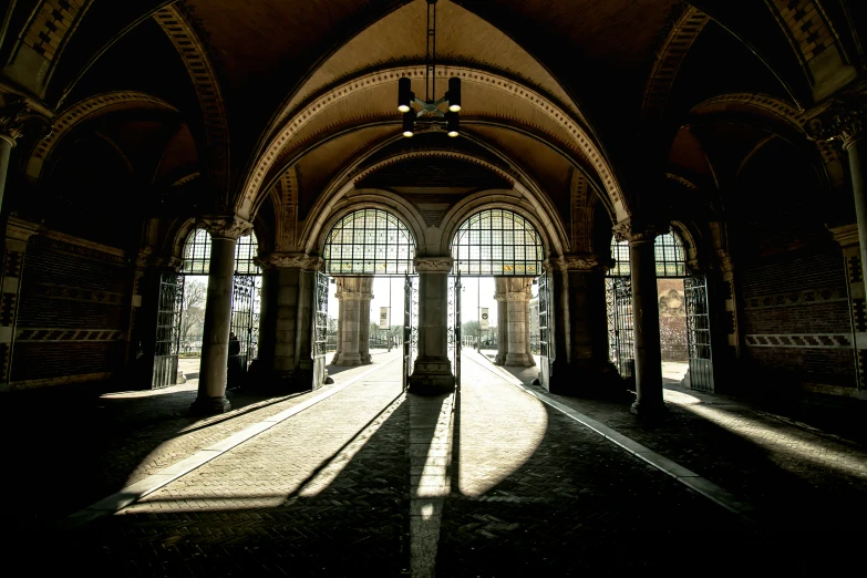 a building with a roof that has arched windows and lots of windows