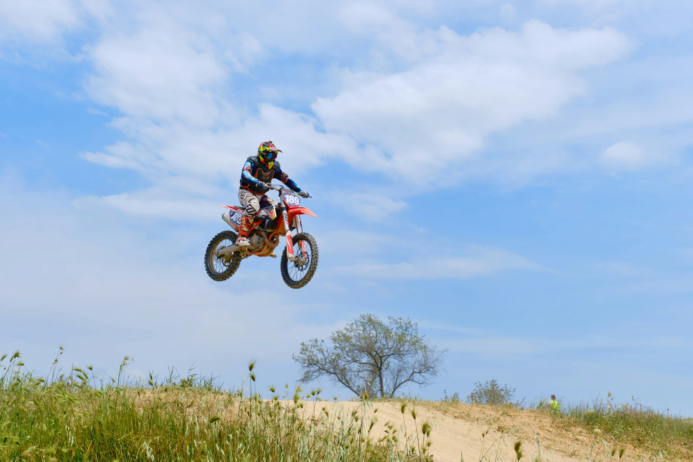 a person jumping up in the air on a motorcycle