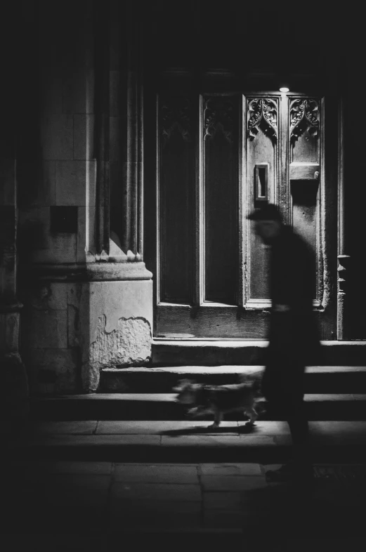 a man walking down the street in a large building