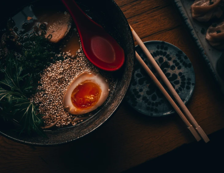 an oriental dish with rice and meats in it