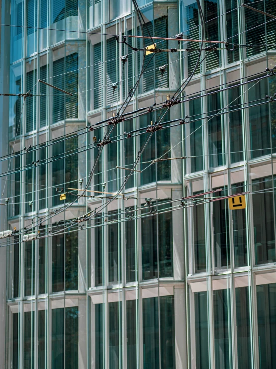 electrical wire encased in glass facade of modern building