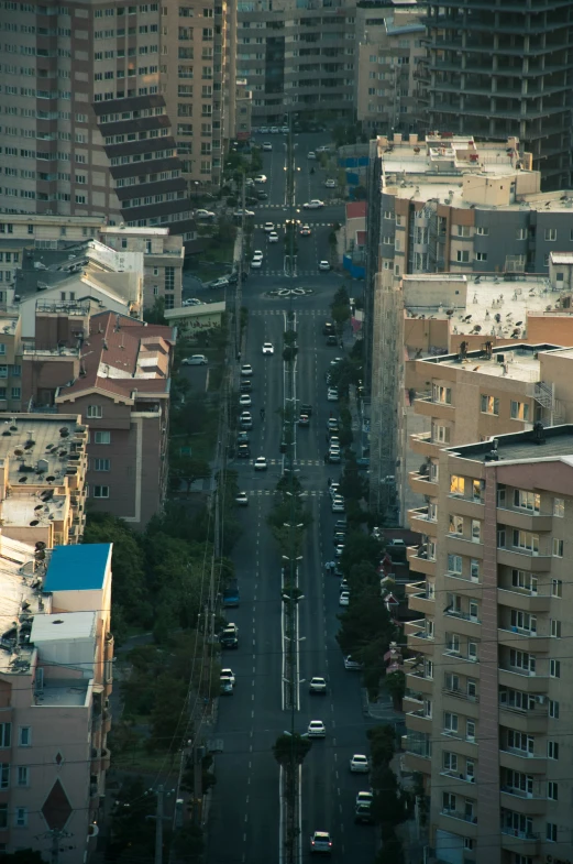 an aerial view of a city street with tall buildings