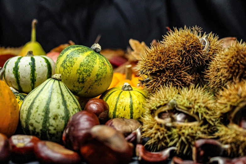 fruit is piled together next to each other on the ground