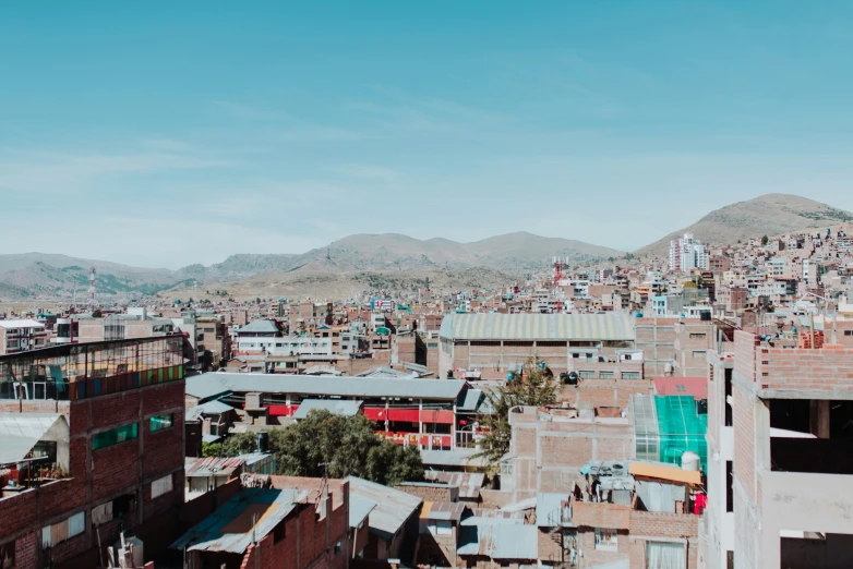 view of a large cityscape with a mountain in the background