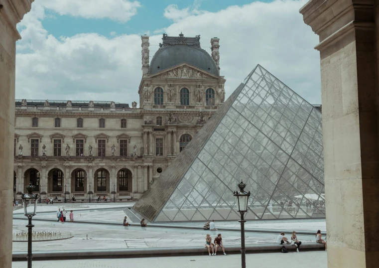 view of a very tall building with a pyramid in the middle