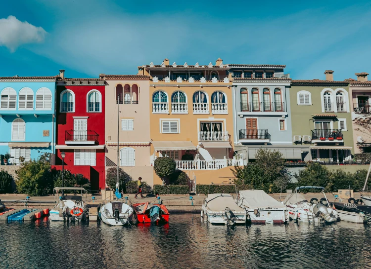 a group of buildings and boats are docked in the water