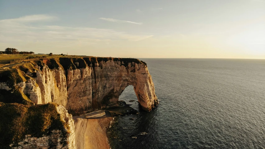 an aerial view of a cliff overlooking the ocean