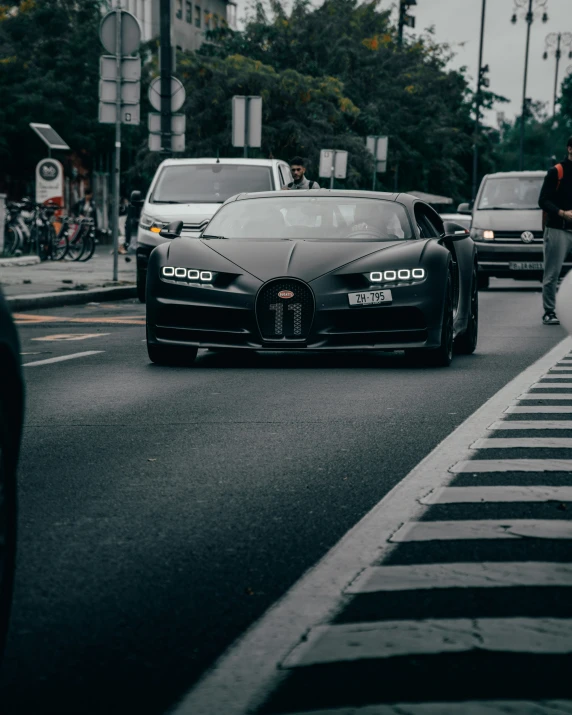 a buggy driving on a street between a traffic signal