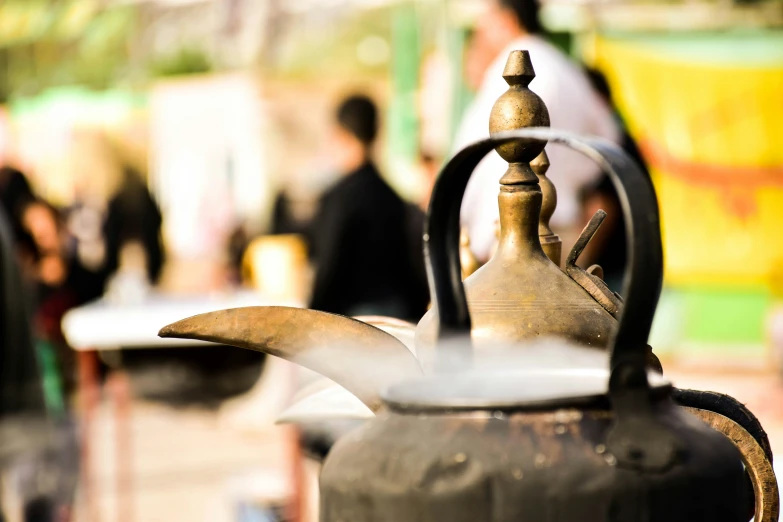 this is a kettle and people in the background