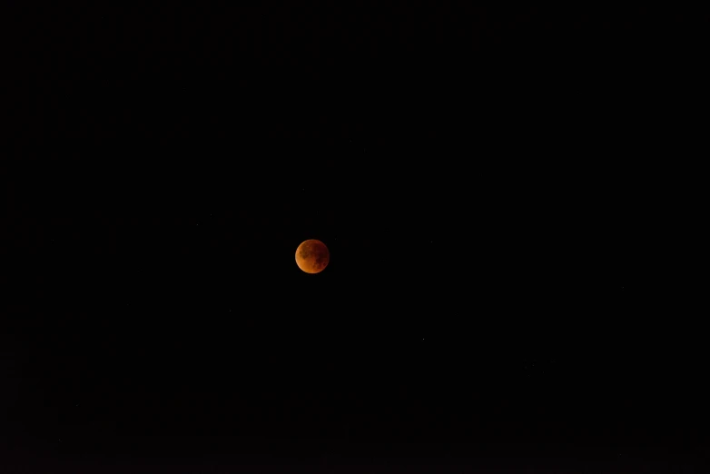 the planet mars as seen through the dark space