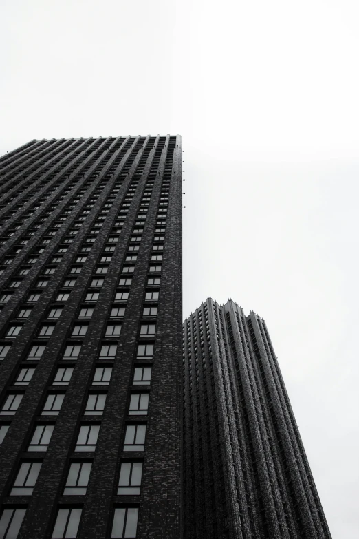 a black and white image of a tall building