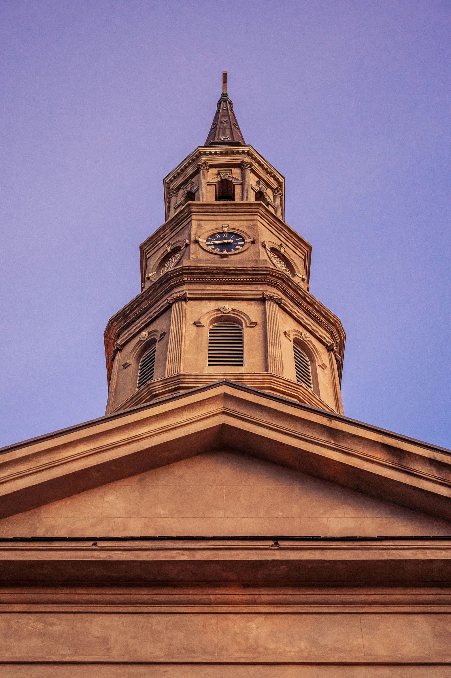 a building with a clock tower and roof