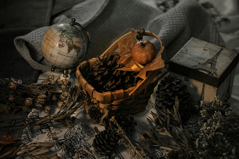 a basket with apples sitting next to books