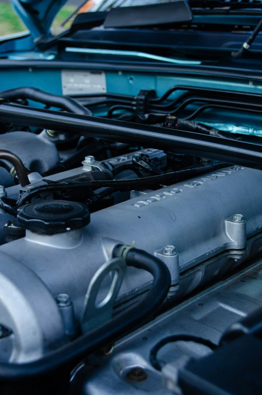 the engine compartment of an automobile parked in a lot