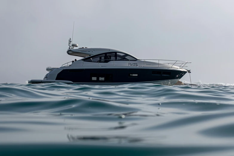 a boat sits in the middle of blue water