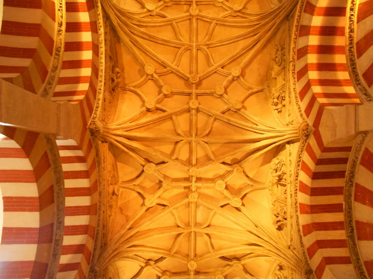 a very ornate ceiling with intricate patterns and arches