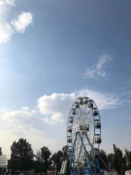 large ferris wheel on the river with other people and water