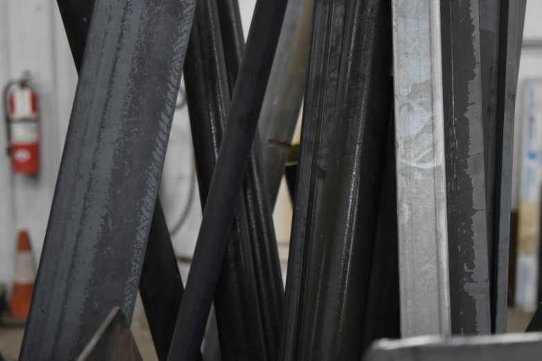 several pieces of steel in a pile that is being made into a sculpture