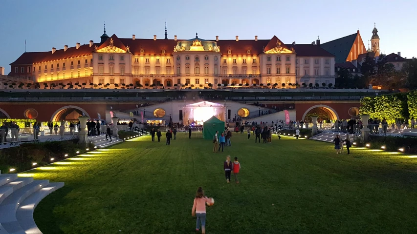 a park is lined with steps, fountains, and a large white building