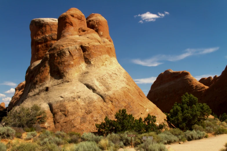 a rocky area with a mountain in the background