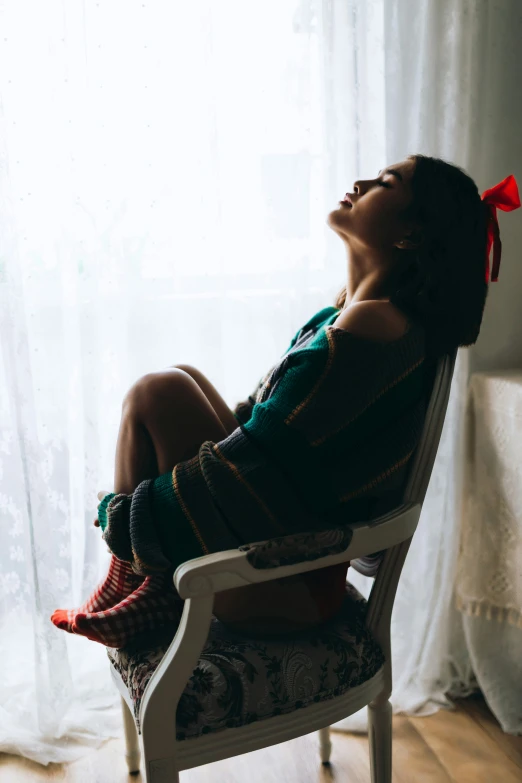 a child that is sitting in a chair