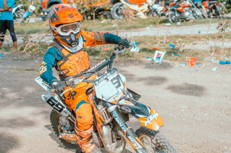 an image of a person that is riding on the dirt bike