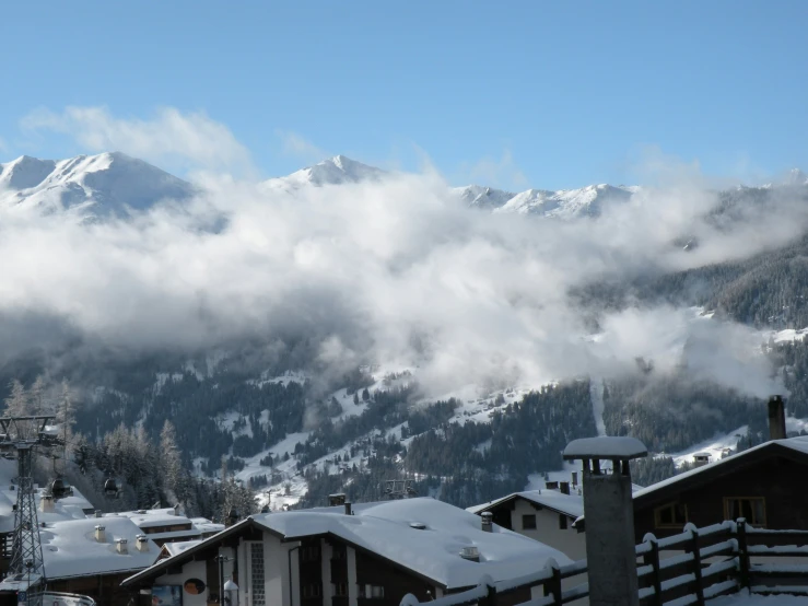 some mountains in the background covered in snow