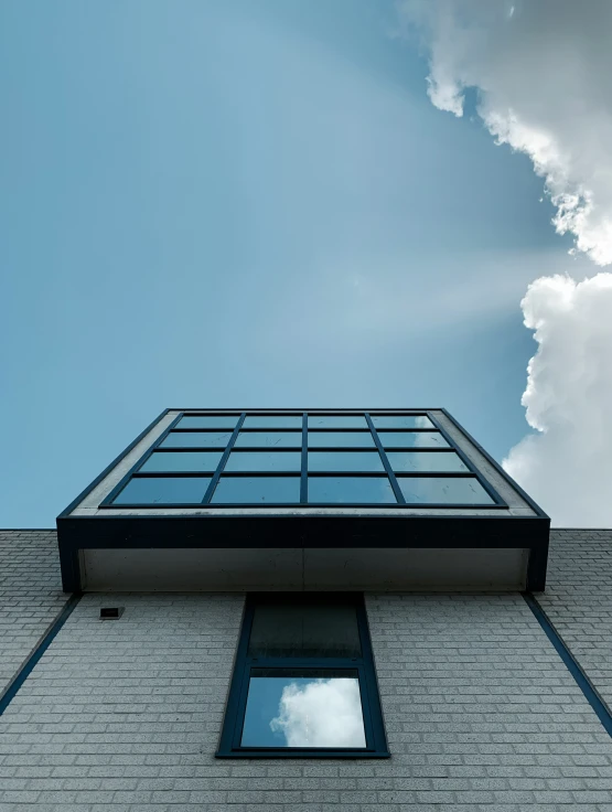 the sky is overcast and cloudy outside the building