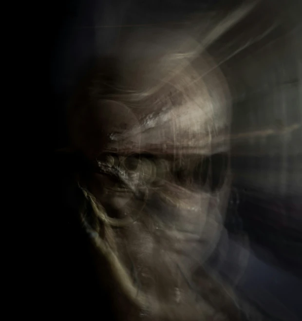 a person with head obscured by the blurry image