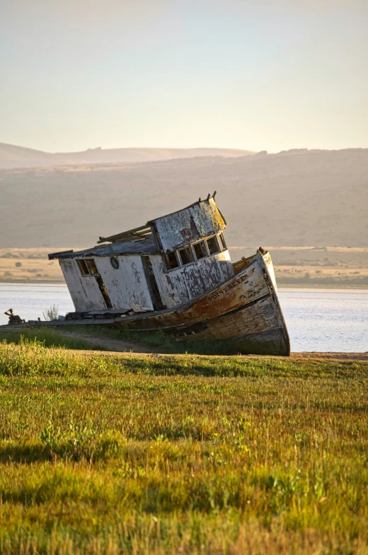 a boat on land that has fallen over