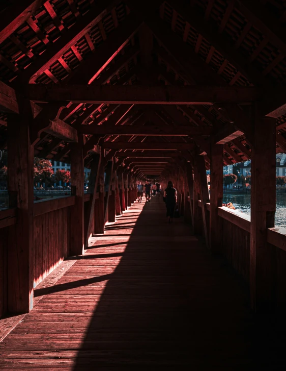 a group of people standing under a covered walkway