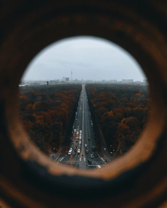 a very high view of the road from the side of a metal window
