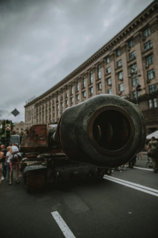 an image of a large cannon and people standing around it