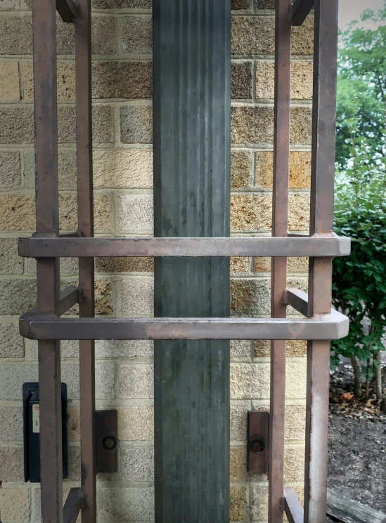 an old fashioned toilet with rusty metal pipes