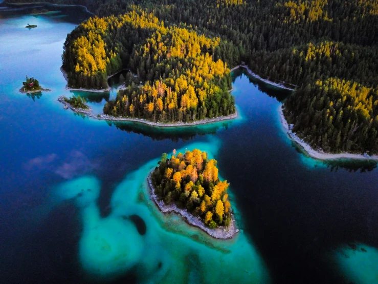 several small islands in the middle of water