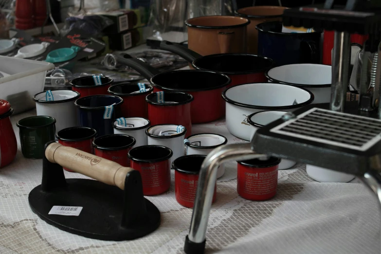 several bowls and a rack with a corkscrew