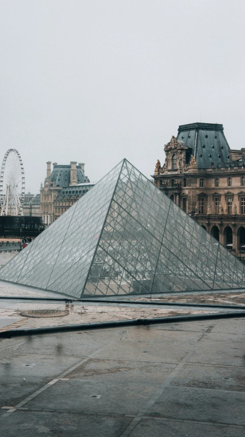 a very tall pyramid sitting on top of a cement street