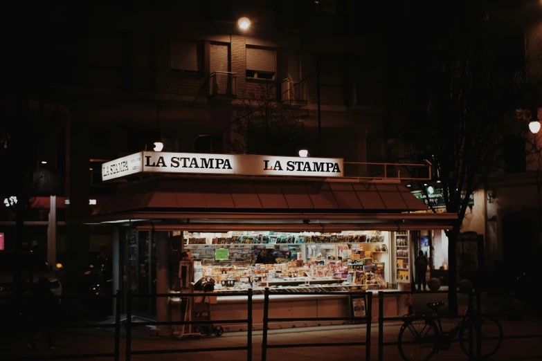 a po taken at night with its lights on and the storefront