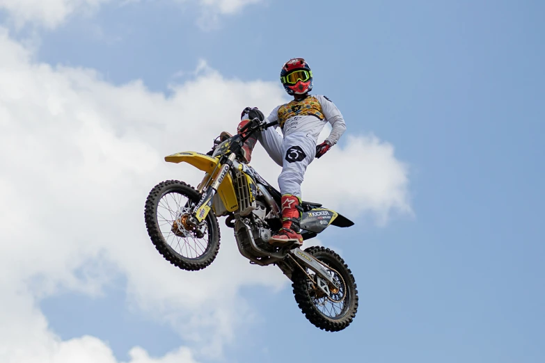 a man riding a motorcycle up in the air