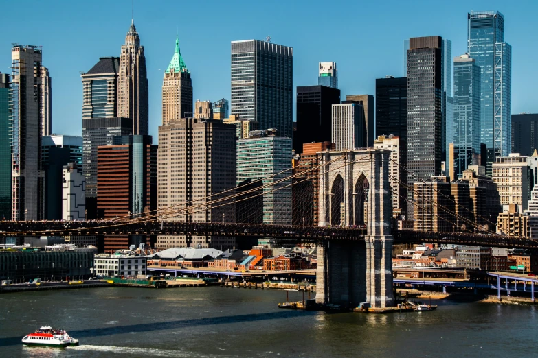 a large city skyline is shown with the bridge