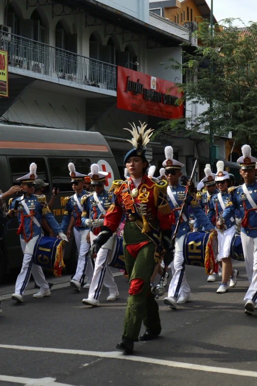 a group of men on the street with marching instruments