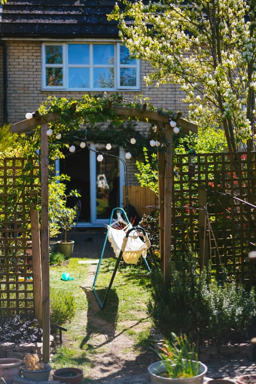 a backyard with several planters in the grass